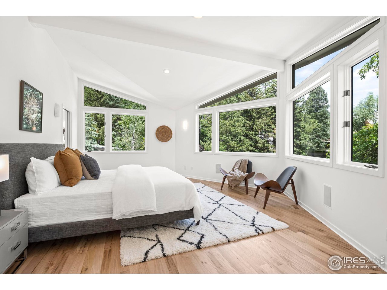 710 Willowbrook Road Boulder, CO 80302 - Photo 18 of 32 a bedroom with a bed and a large window