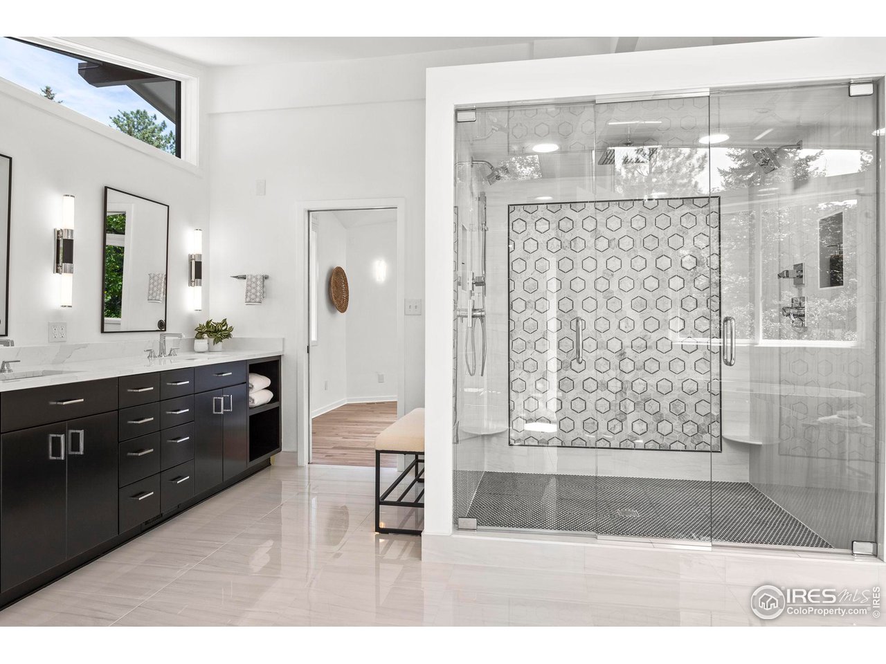 710 Willowbrook Road Boulder, CO 80302 - Photo 20 of 32 a bathroom with a glass shower door and a sink