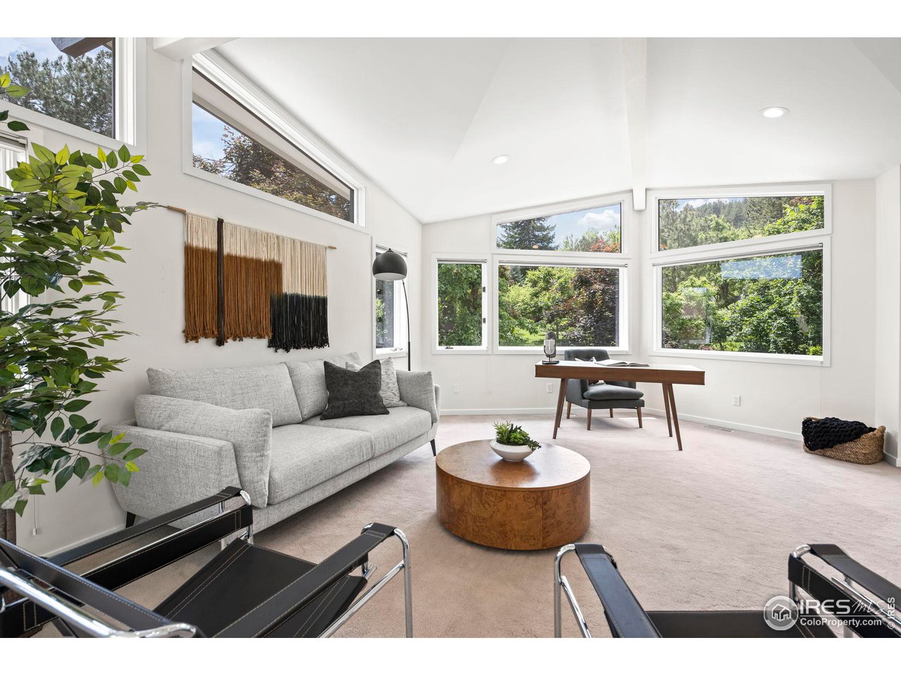 710 Willowbrook Road Boulder, CO 80302 - Photo 23 of 32 a living room with furniture and a large window