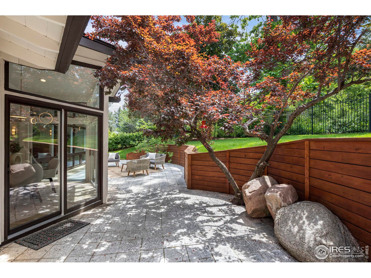 710 Willowbrook Road Boulder, CO 80302 - Photo 26 of 32 a view of a backyard with wooden floor and outdoor seating