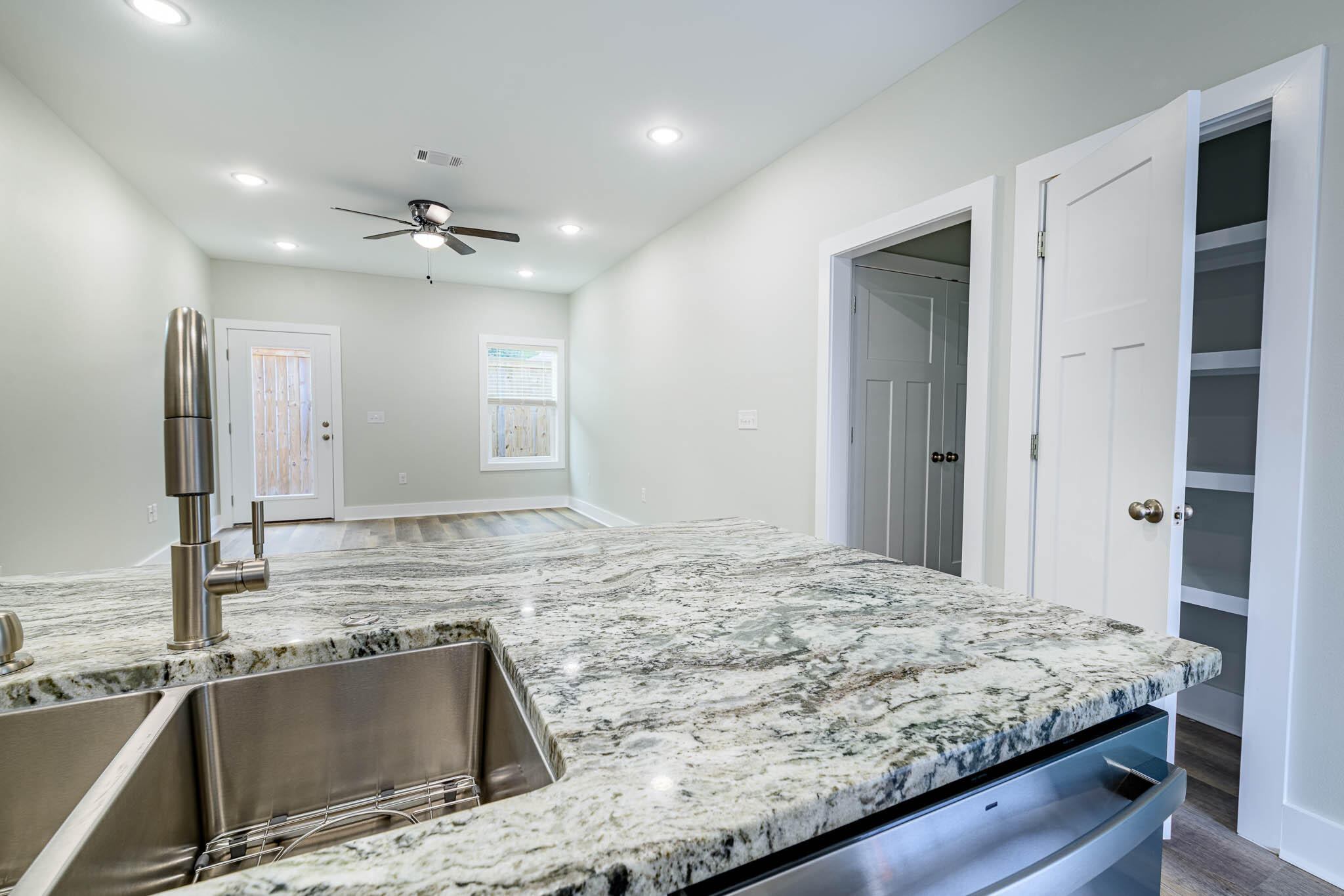 105 Clearing Way Valparaiso, FL 32580 - Photo 27 of 28 a view of kitchen with kitchen island a sink and a refrigerator