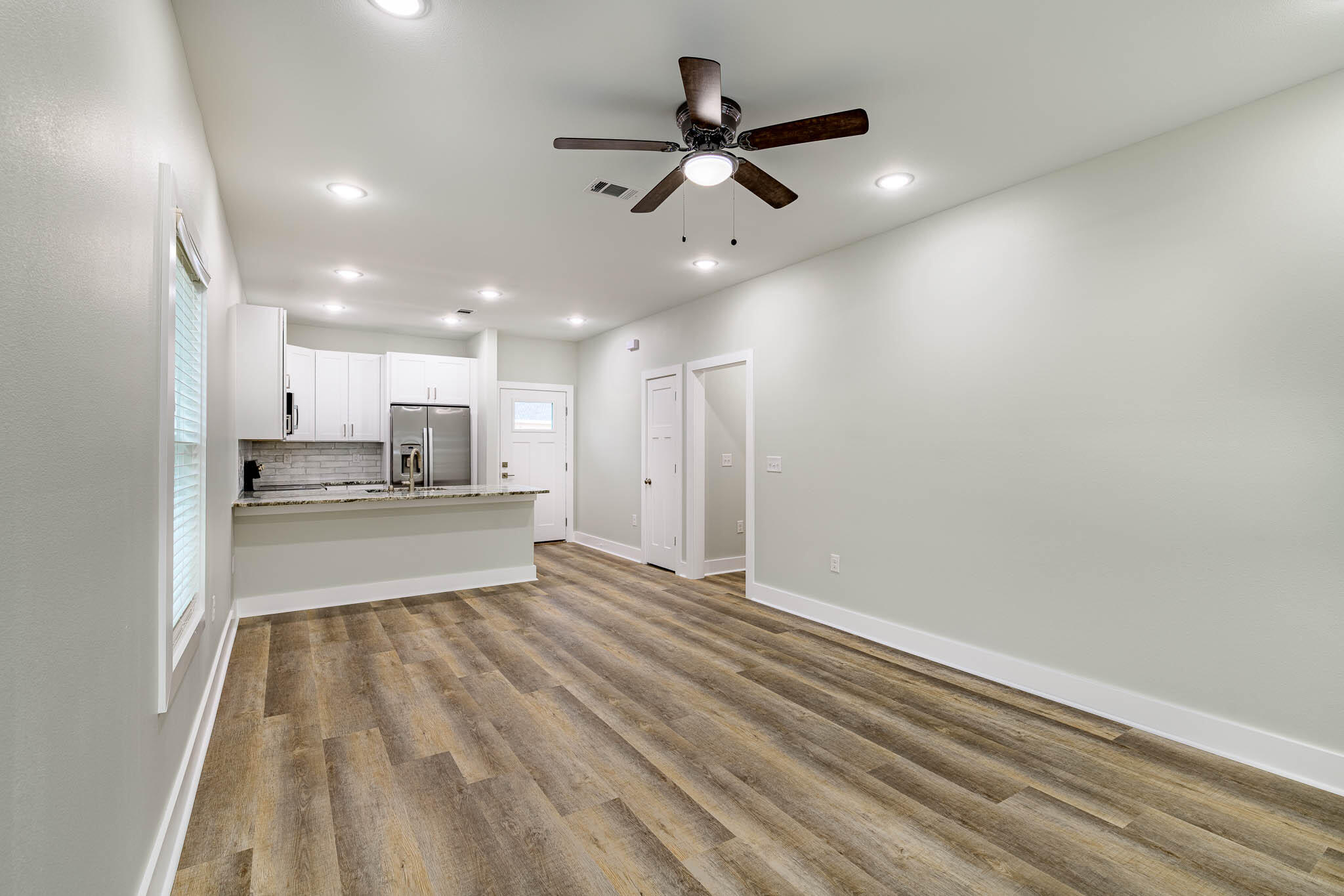 105 Clearing Way Valparaiso, FL 32580 - Photo 6 of 28 a view of kitchen with stainless steel appliances refrigerator stove microwave and cabinets