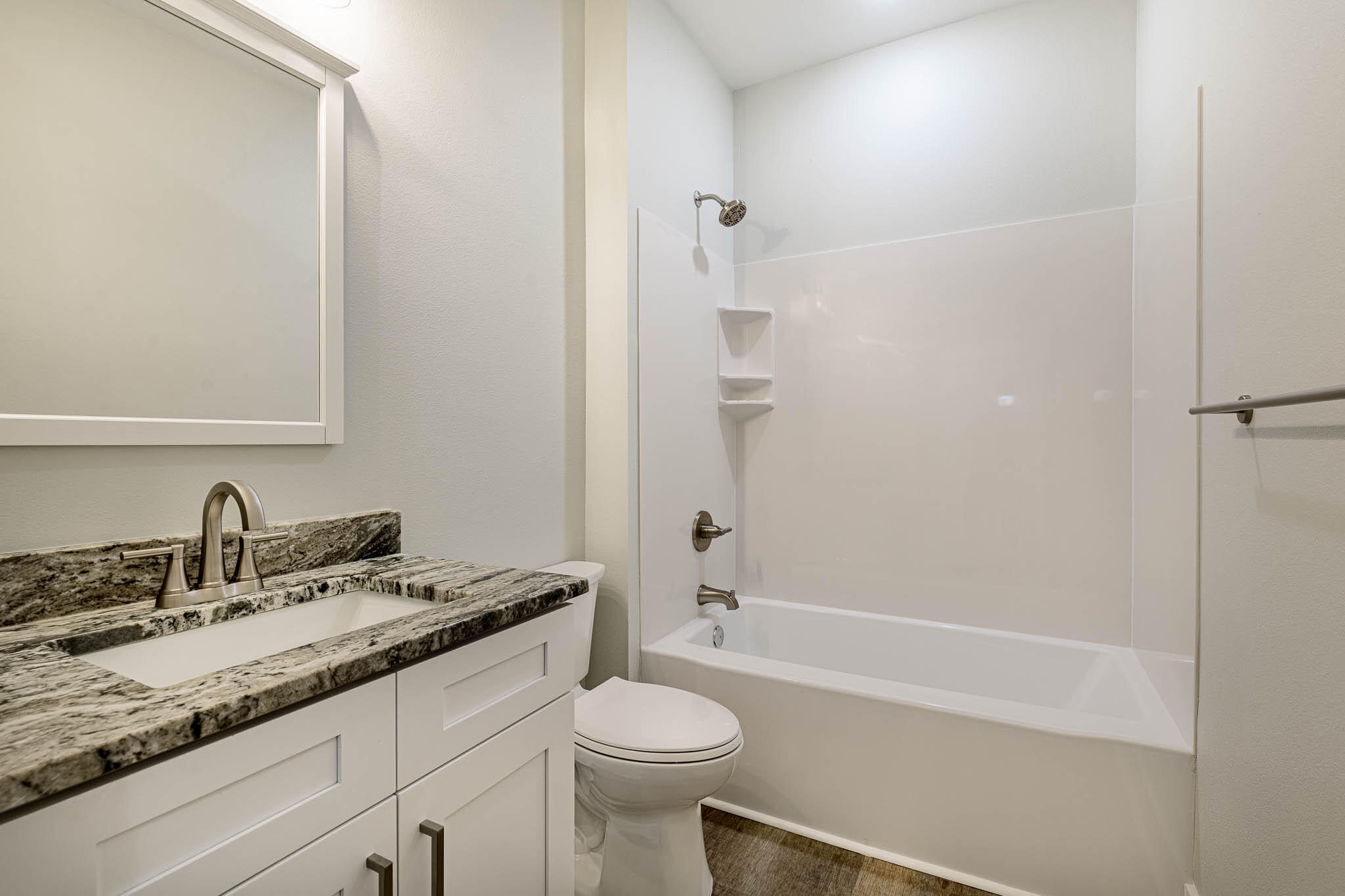 105 Clearing Way Valparaiso, FL 32580 - Photo 7 of 28 a bathroom with a granite countertop sink toilet and shower