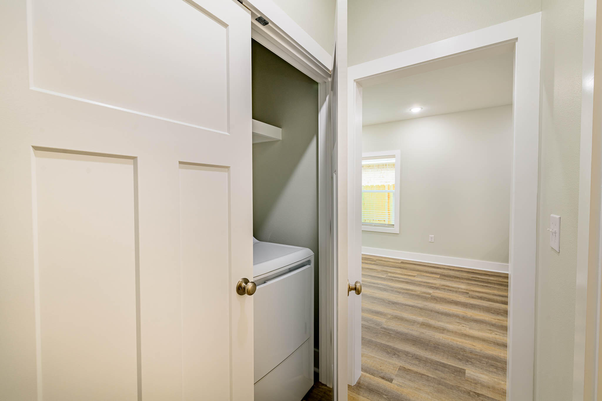 105 Clearing Way Valparaiso, FL 32580 - Photo 9 of 28 a view of a hallway with wooden floor and entryway