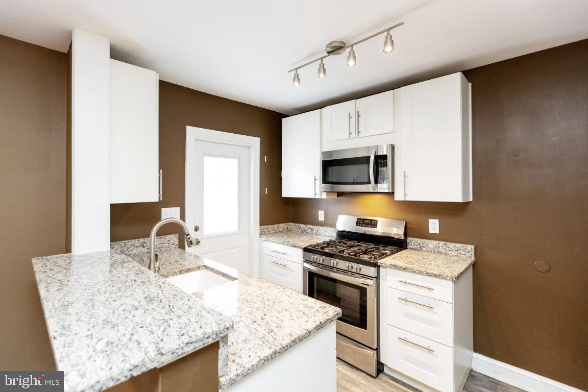 1348 Rittenhouse Street Northwest Washington, DC 20011 - Photo 10 of 27 Kitchen w/ granite & stainless steel
