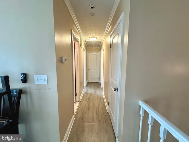 a view of a hallway with a room