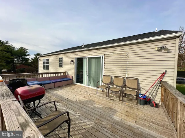 a view of a chairs and table on the deck