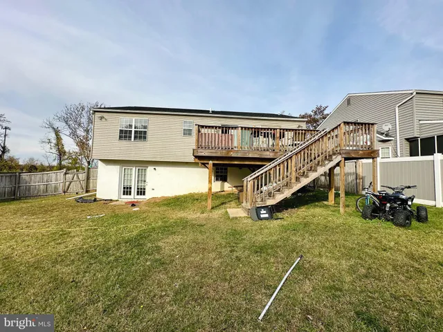 a view of an house with swimming pool and deck