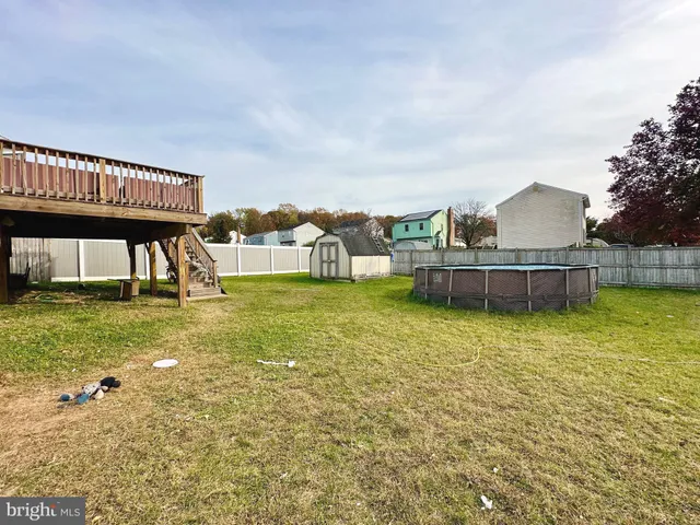 a view of a house with a garden and plants