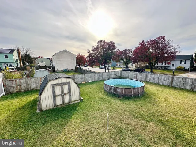 a view of a swimming pool and lounge chairs