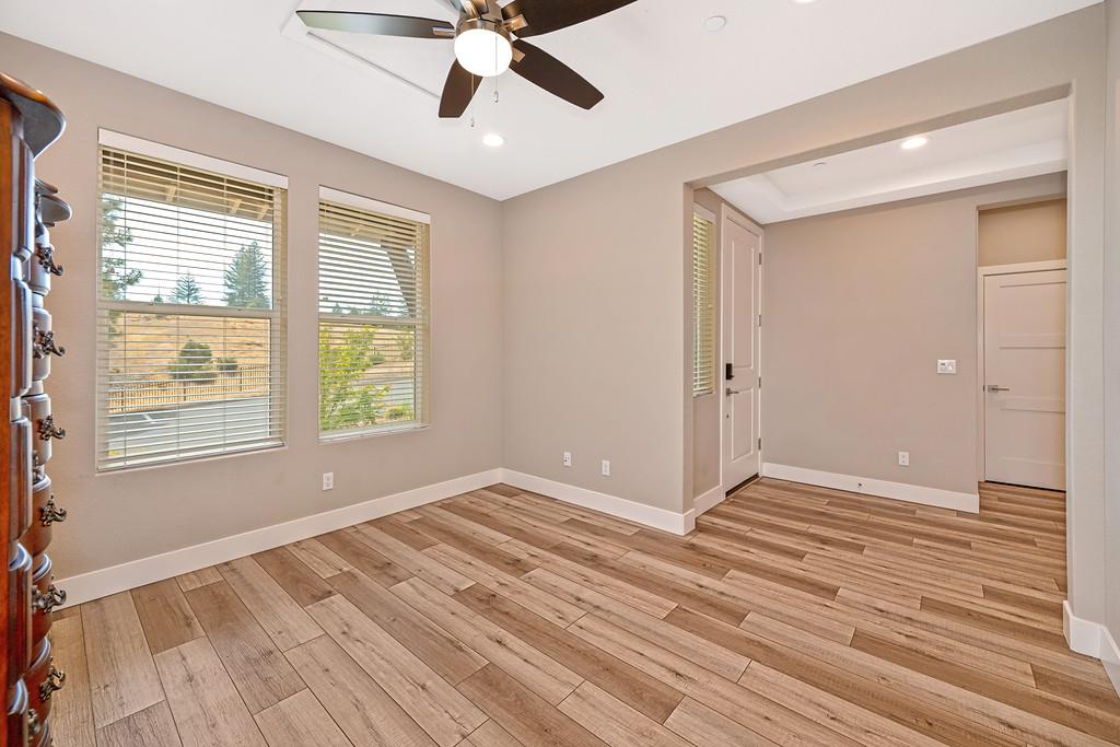 504 Chase Court Colfax, CA 95713 - Photo 28 of 94 a view of an empty room with wooden floor and a window