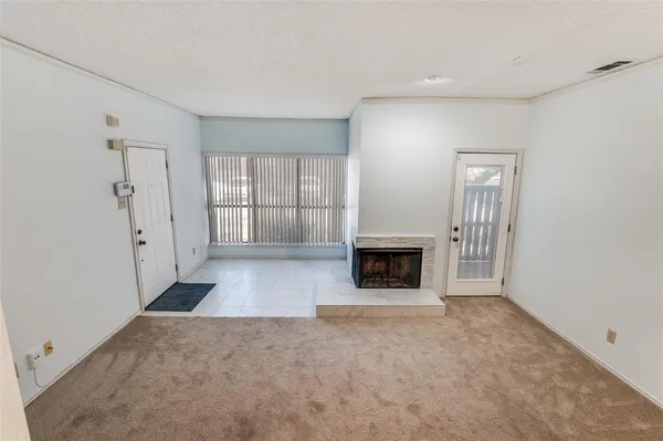 a view of a livingroom with a fireplace