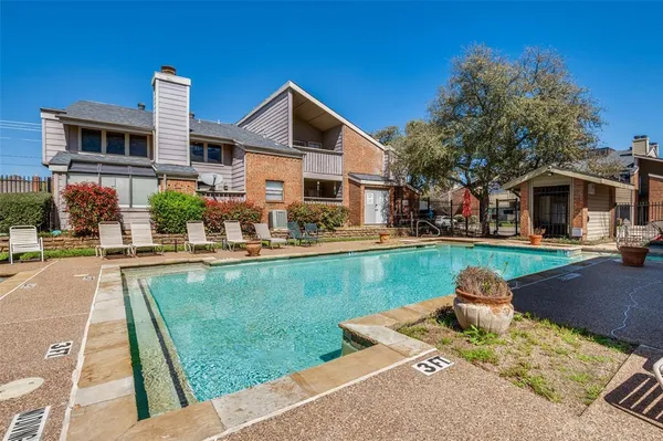a front view of a house with swimming pool