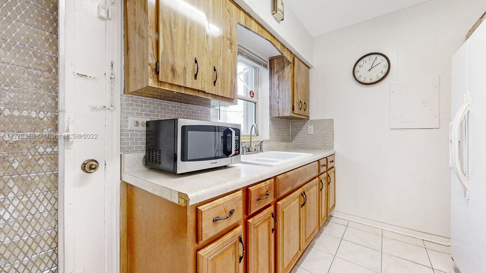 a kitchen with stainless steel appliances granite countertop a stove and a microwave oven