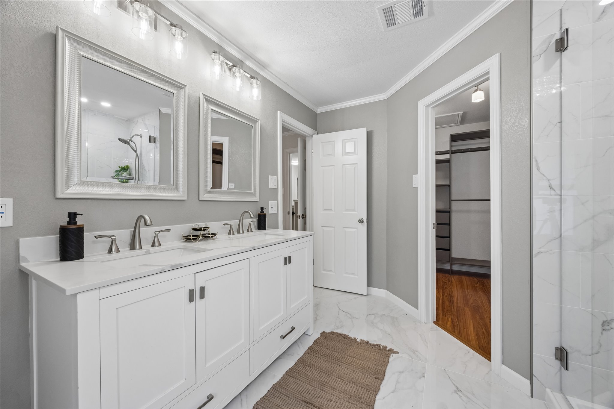 1306 Shady Grove Path Cedar Park, TX 78613 - Photo 22 of 40 a bathroom with a double vanity sink and a mirror