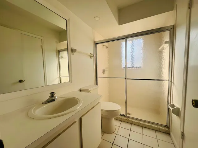 a bathroom with a sink and a shower