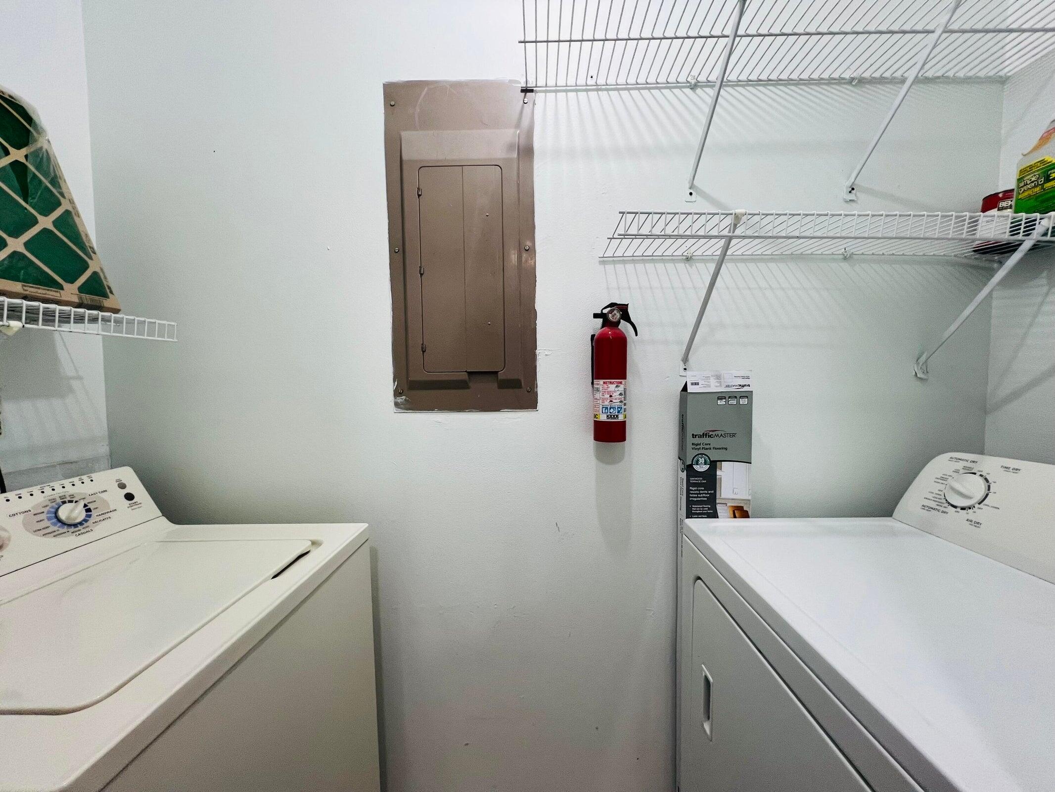 11877 Sturbridge Lane Wellington, FL 33414 - Photo 16 of 20 a utility room with dryer and washer