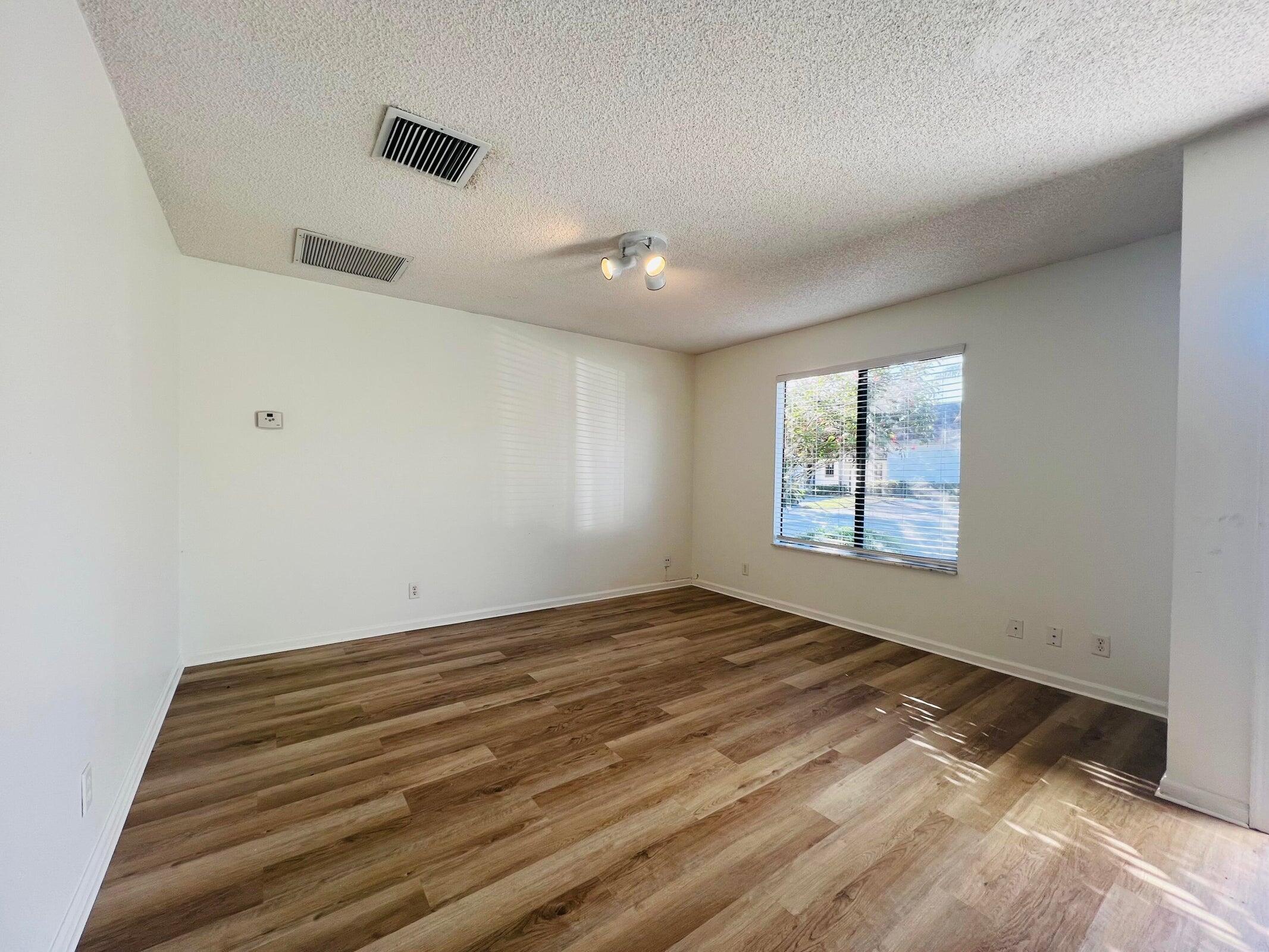 11877 Sturbridge Lane Wellington, FL 33414 - Photo 8 of 20 a view of an empty room with a window