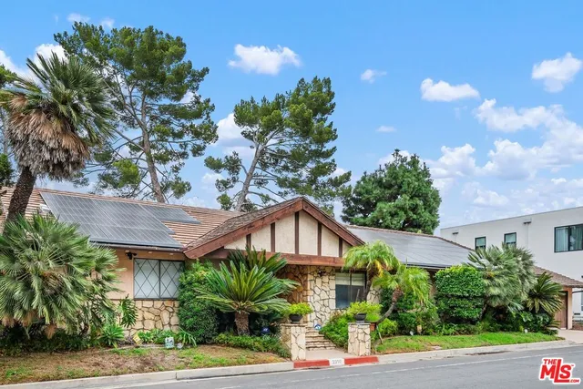 a house view with a garden space