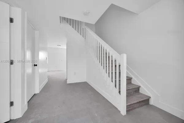 a view of staircase with white walls and white walls