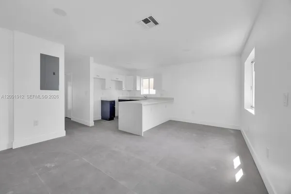 a view of a kitchen with a sink cabinets and a window