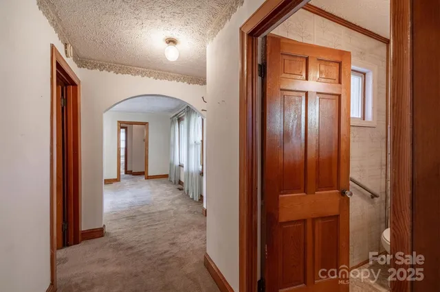 front view of a hallway with wooden door