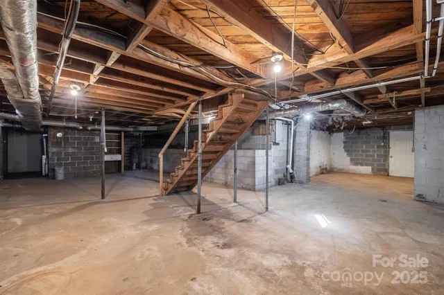 a view of empty room with wooden ceiling