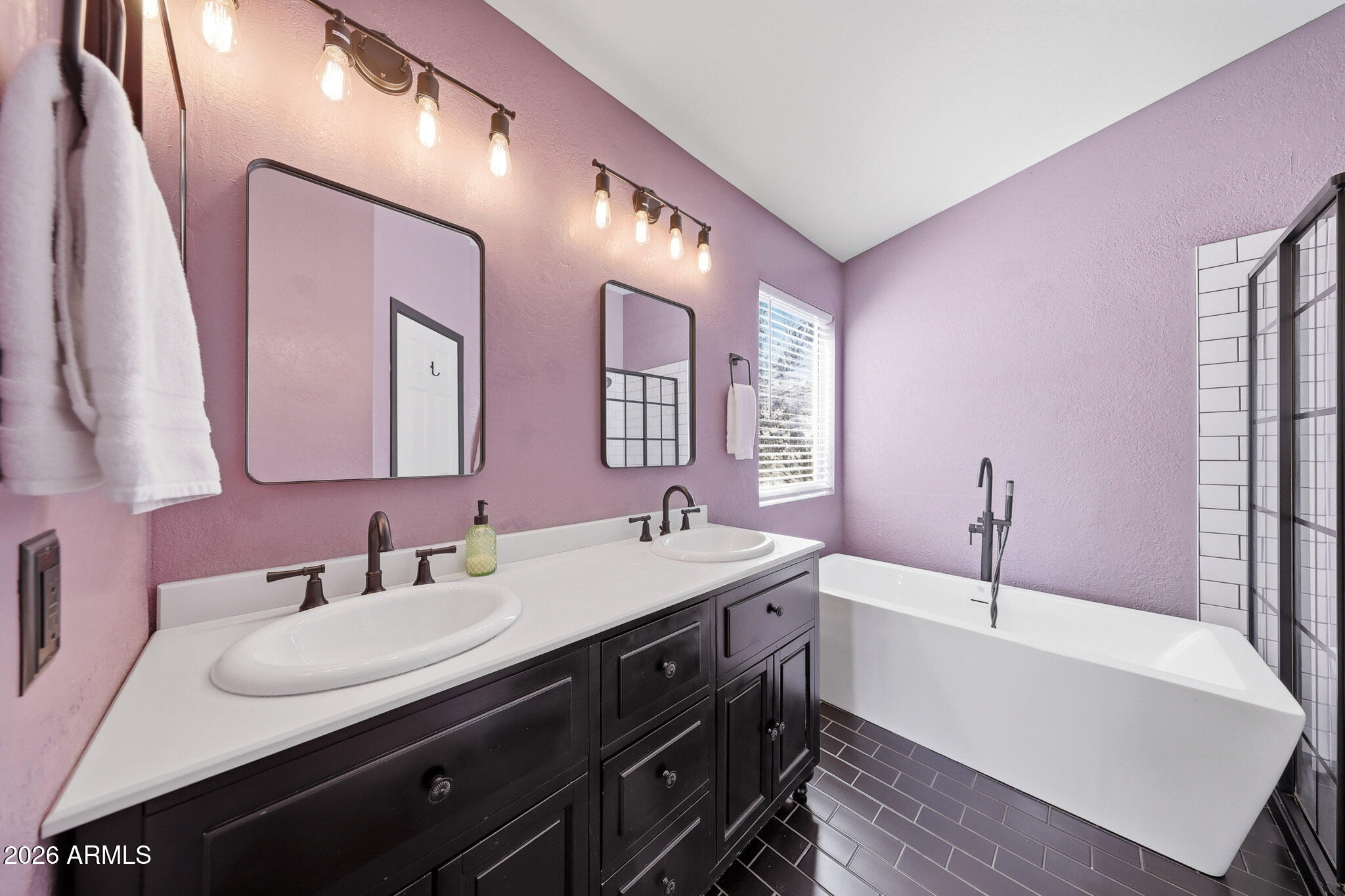 2167 East Nighthawk Way Phoenix, AZ 85048 - Photo 5 of 28 a bathroom with a sink and a mirror