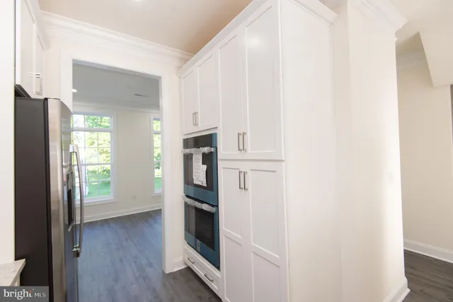 a view of a kitchen with a sink and a stove