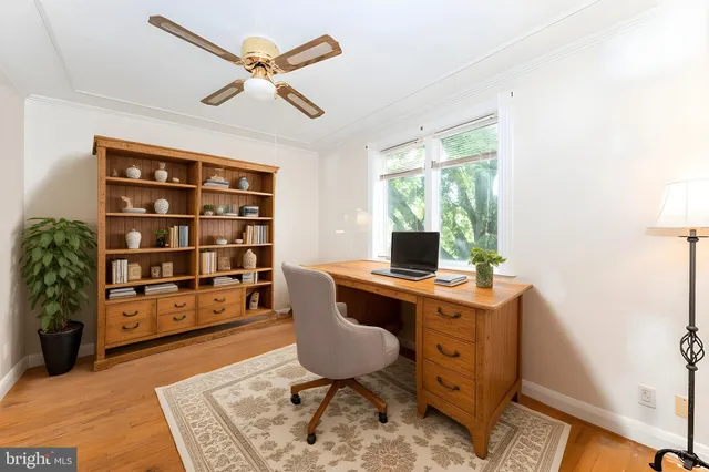a view of a workspace with furniture