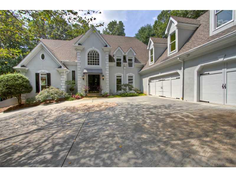 Exterior Front. Private drive leads to home with 3 car garage.