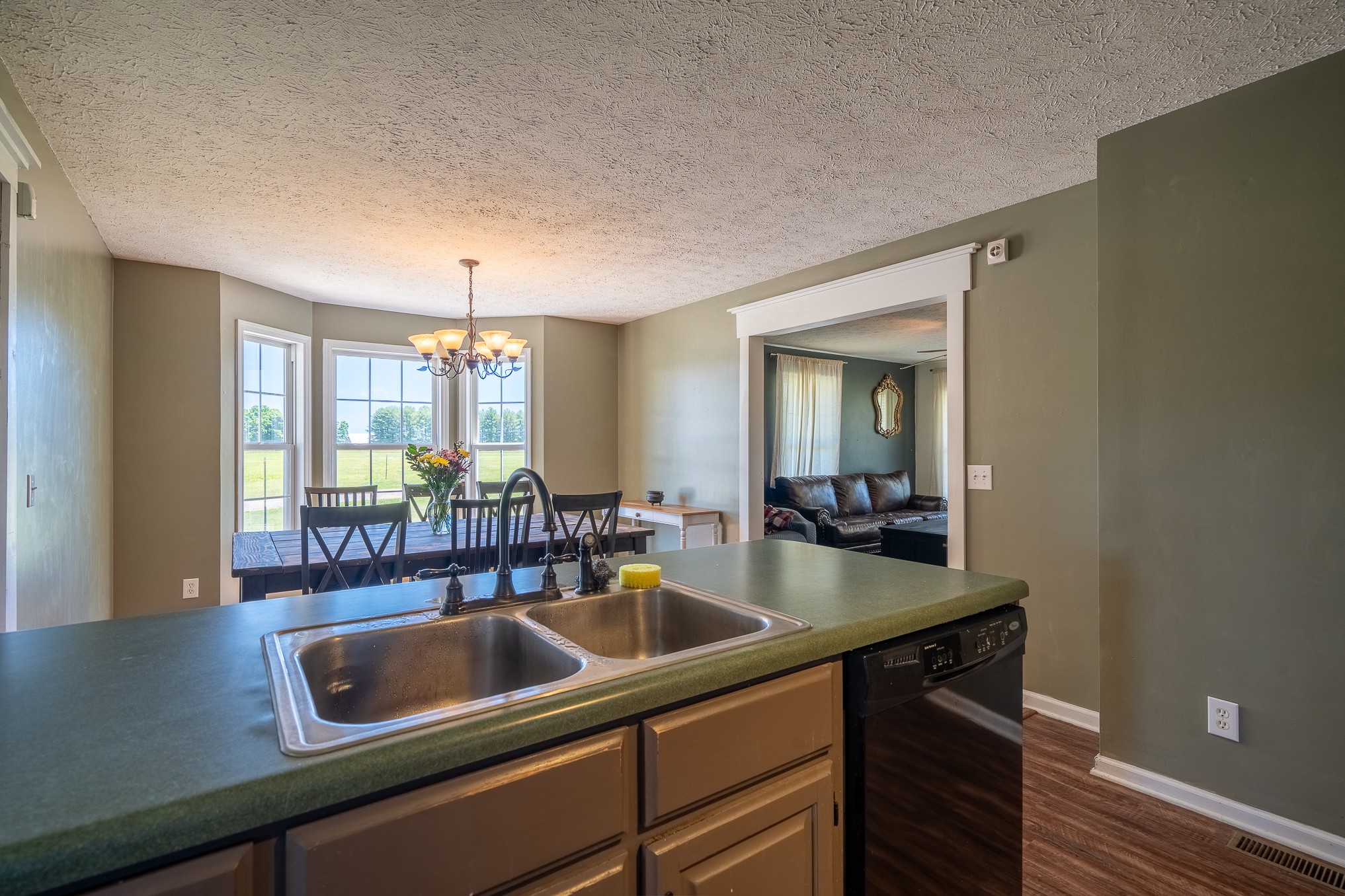 11220 Shelbyville Road Morrison, TN 37357 - Photo 12 of 67 a kitchen with a sink and a refrigerator