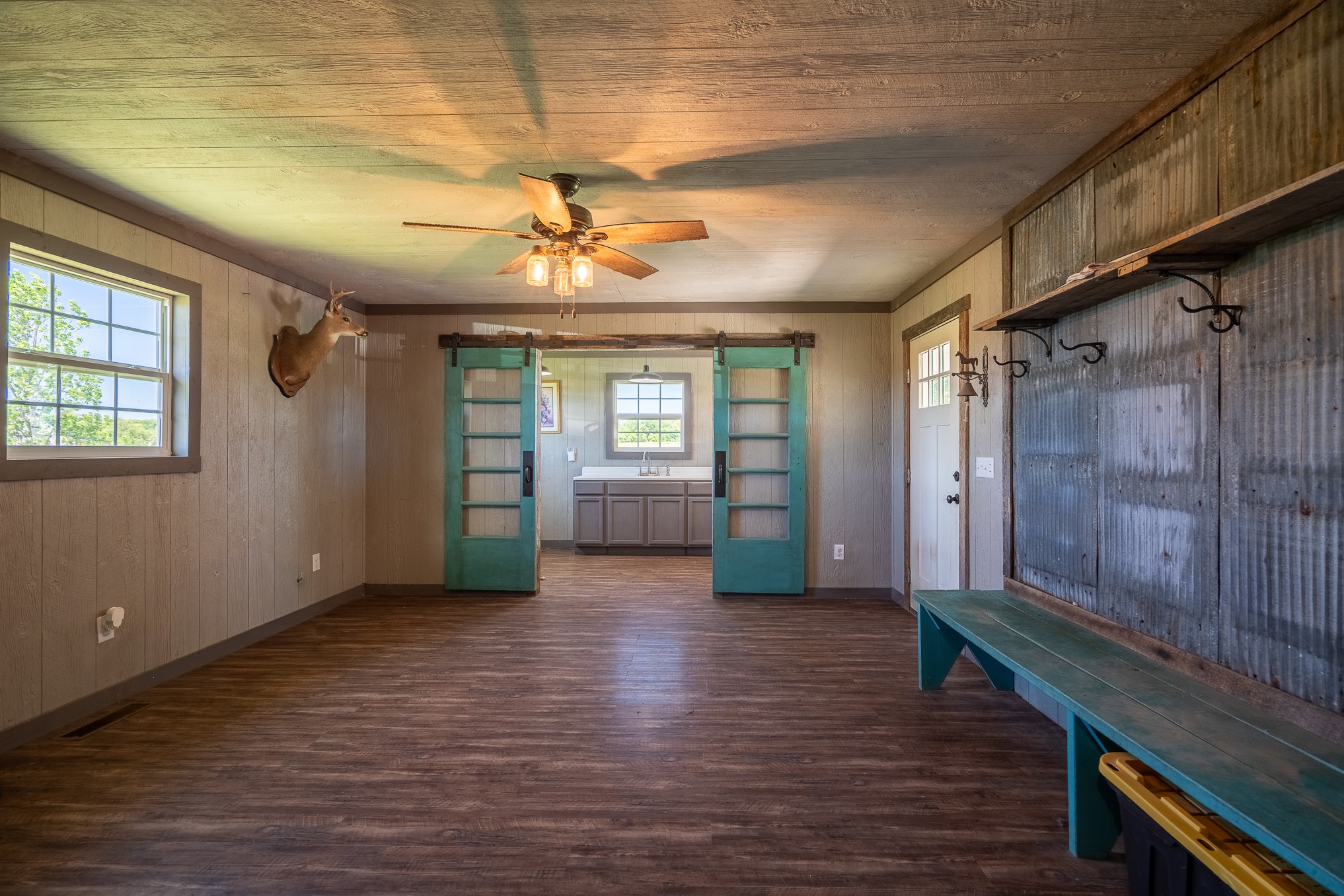 11220 Shelbyville Road Morrison, TN 37357 - Photo 15 of 67 a view of an empty room with window and wooden floor