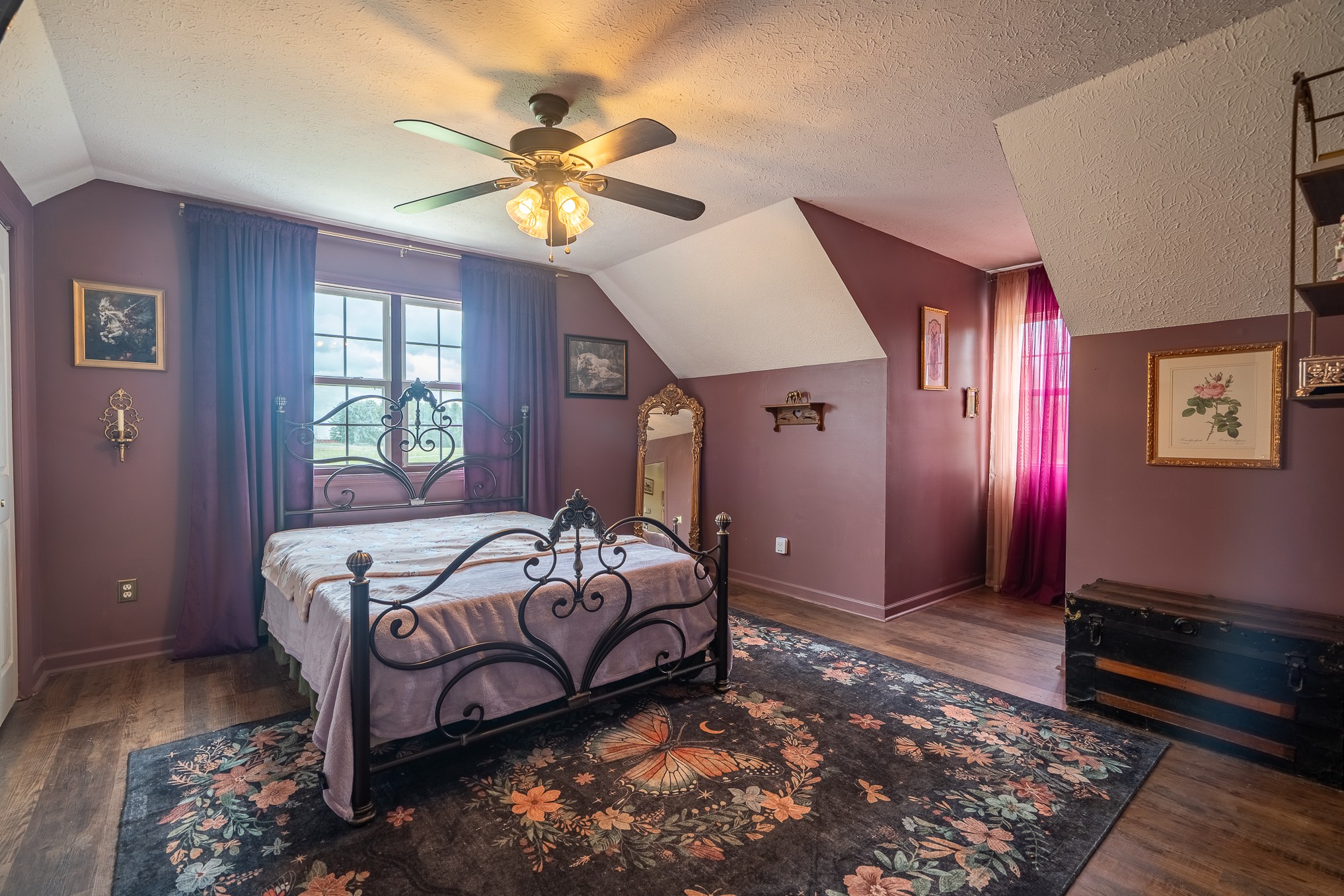 11220 Shelbyville Road Morrison, TN 37357 - Photo 26 of 67 a bedroom with a bed and a chandelier
