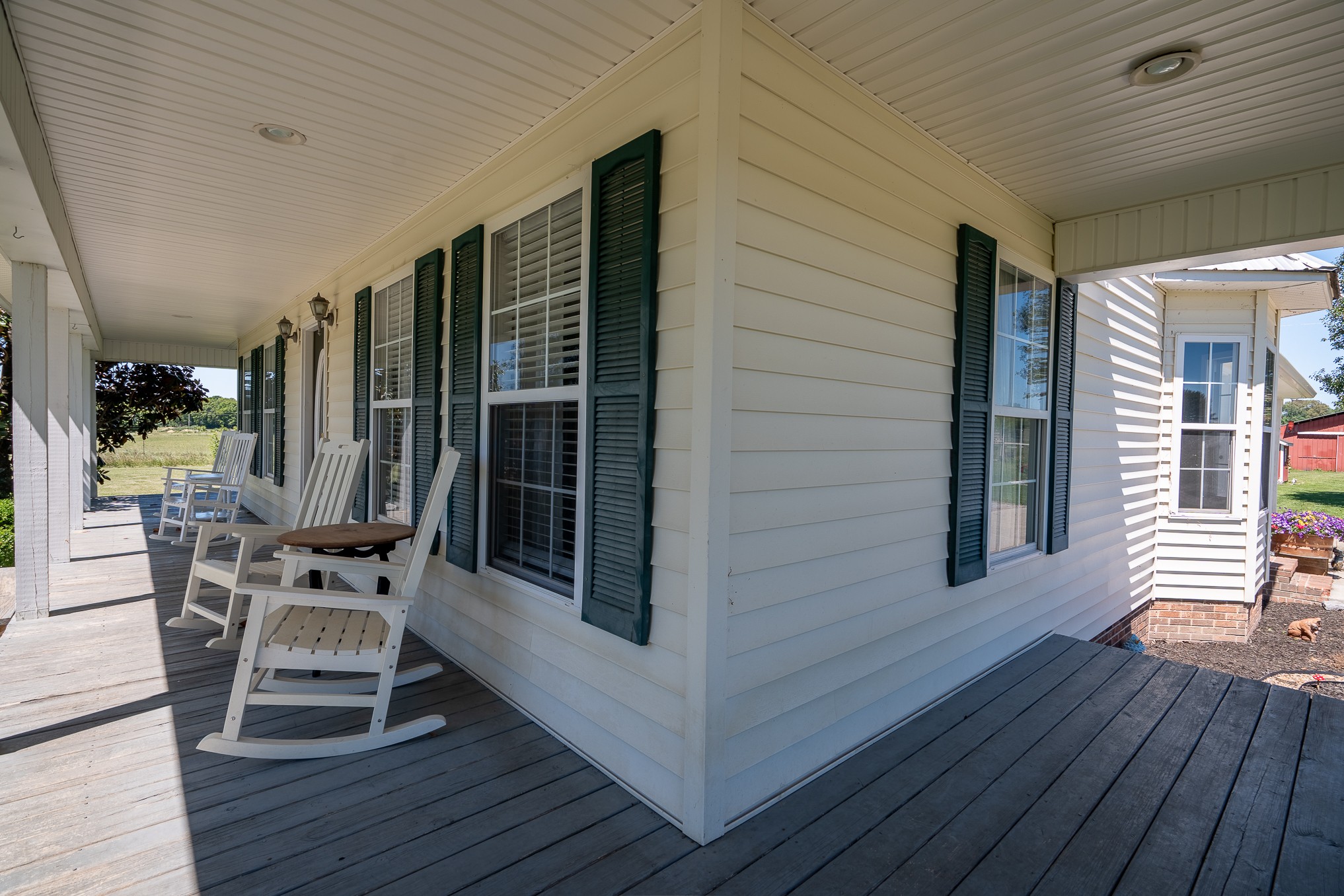 11220 Shelbyville Road Morrison, TN 37357 - Photo 48 of 67 a view of a patio with table and chairs with wooden floor and floor to ceiling window