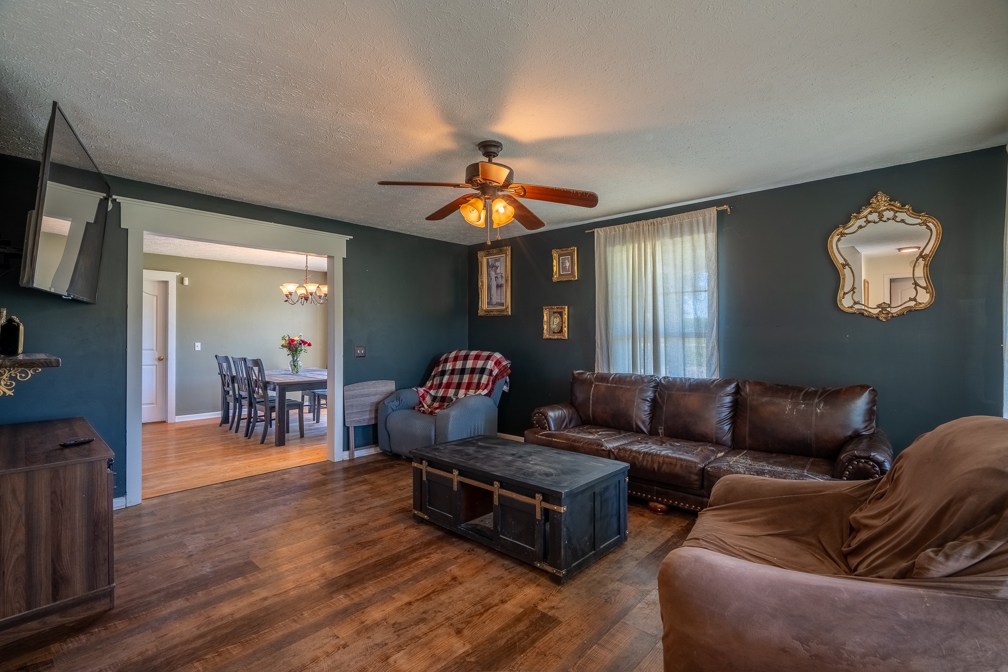 11220 Shelbyville Road Morrison, TN 37357 - Photo 5 of 67 a living room with furniture and a chandelier