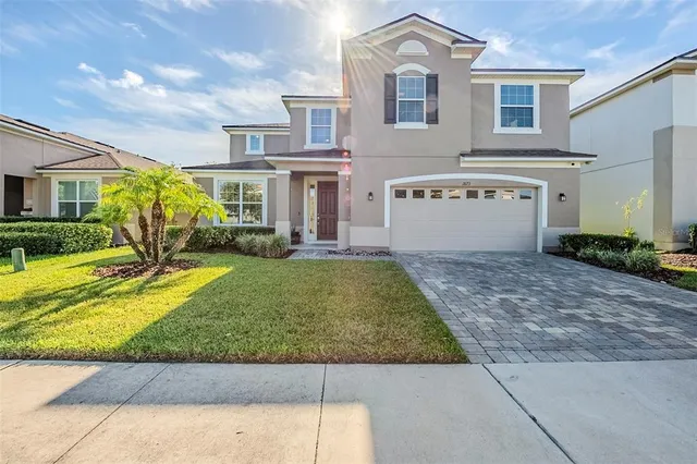 a view of house with yard and outdoor seating