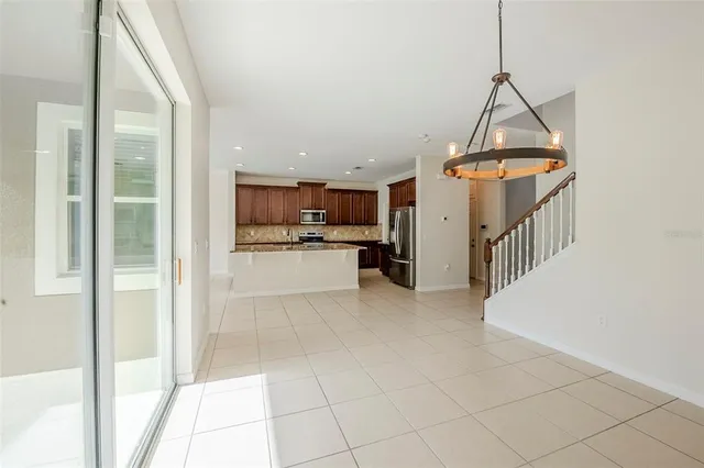 a view of a kitchen with furniture and a window