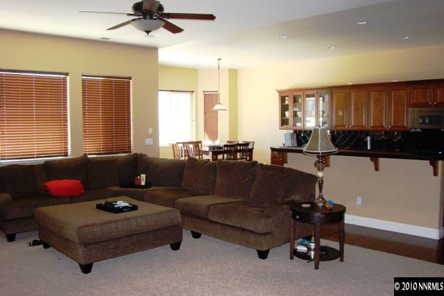 10550 Kenai Drive Reno, NV 89521 - Photo 2 of 9 a living room with furniture gym equipment and a window