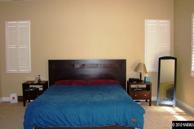 10550 Kenai Drive Reno, NV 89521 - Photo 7 of 9 a bedroom with a bed and a potted plant
