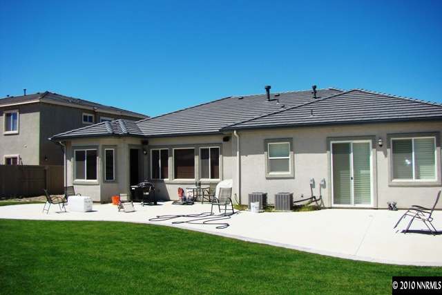 10550 Kenai Drive Reno, NV 89521 - Photo 9 of 9 a front view of a house with swimming pool and furniture