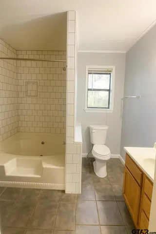 a utility room with a sink and a mirror