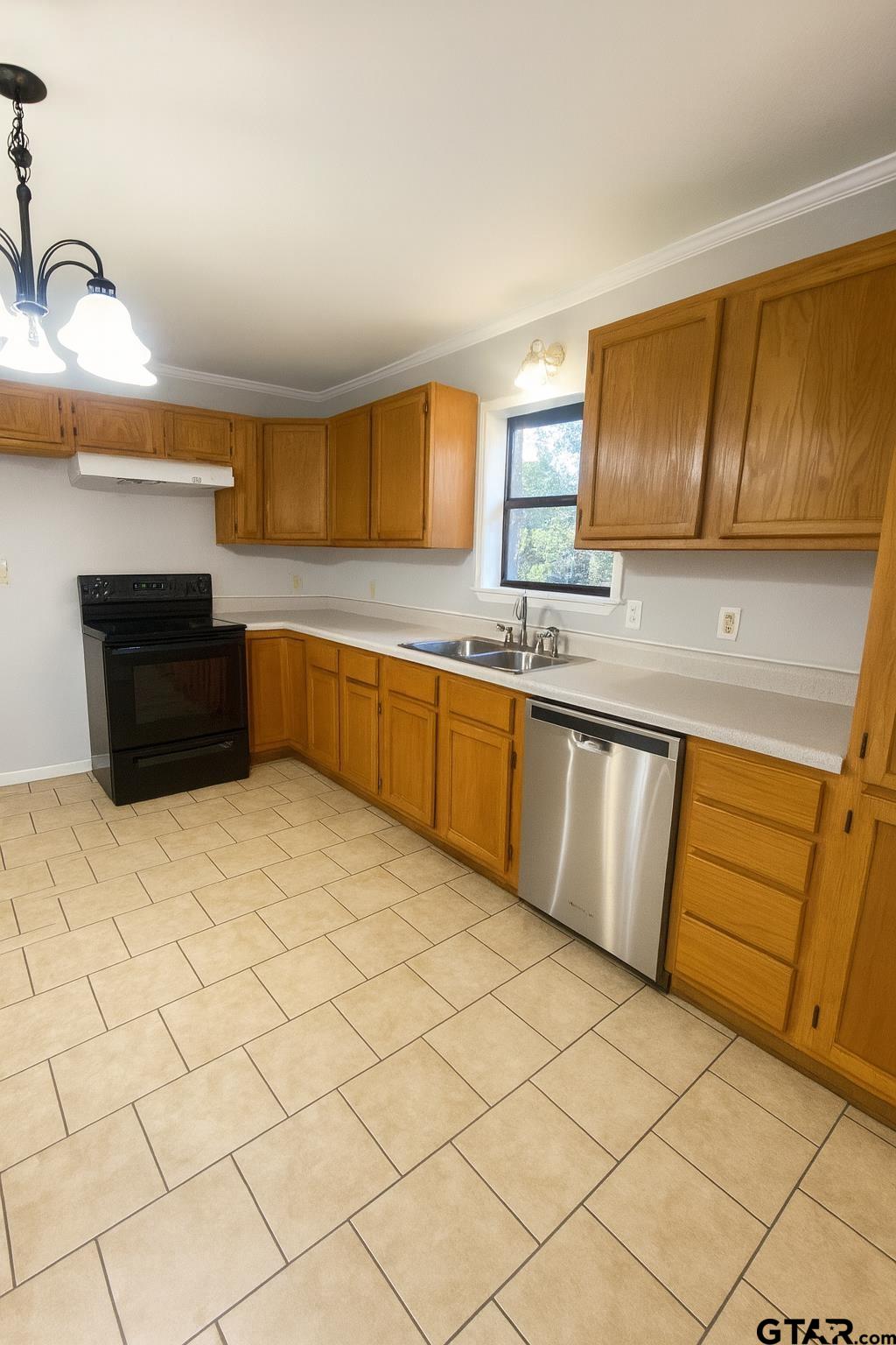23601 State Highway 64 Troup, TX 75789 - Photo 10 of 19 a kitchen with granite countertop a sink and cabinets