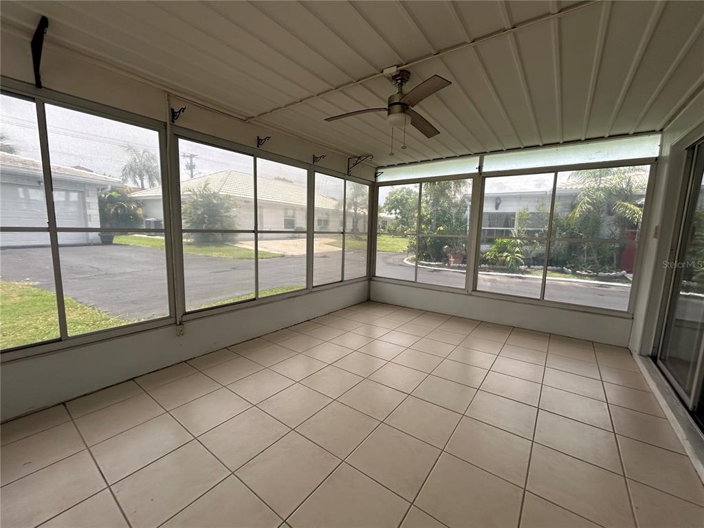 8521 Pickwick Road North Port, FL 34287 - Photo 10 of 19 an empty room with windows and city view