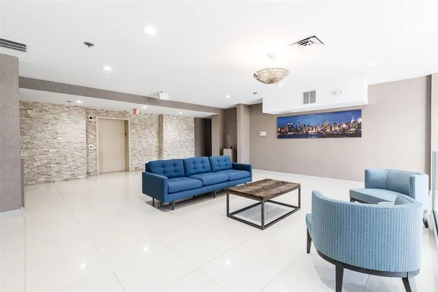 a living room with furniture and a rug