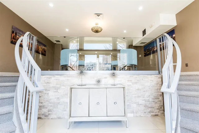 a bathroom with a granite countertop sink a mirror and a shower