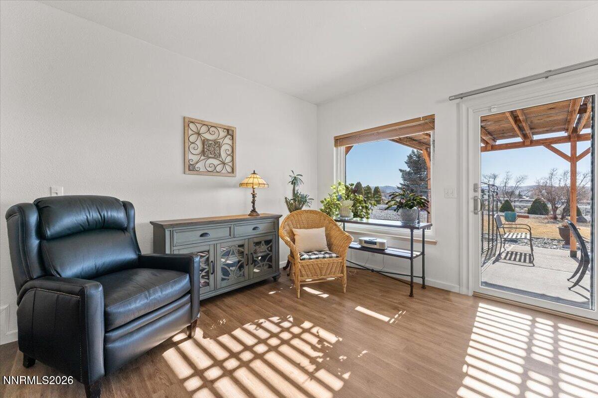 9580 Benedict Drive Sparks, NV 89441 - Photo 17 of 40 a living room with furniture and a floor to ceiling window