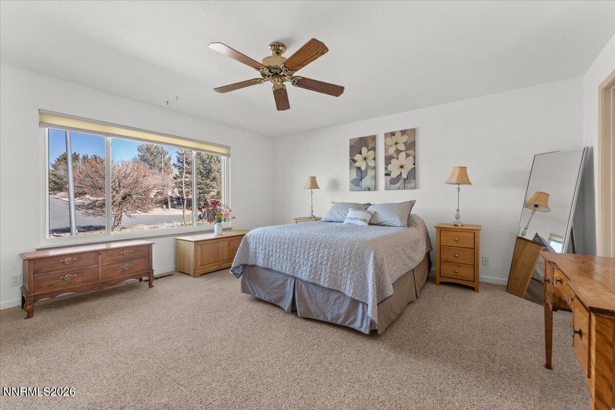 9580 Benedict Drive Sparks, NV 89441 - Photo 20 of 40 a spacious bedroom with a large bed and a large window