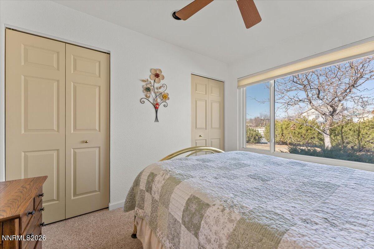 9580 Benedict Drive Sparks, NV 89441 - Photo 23 of 40 a bedroom with a bed and a window