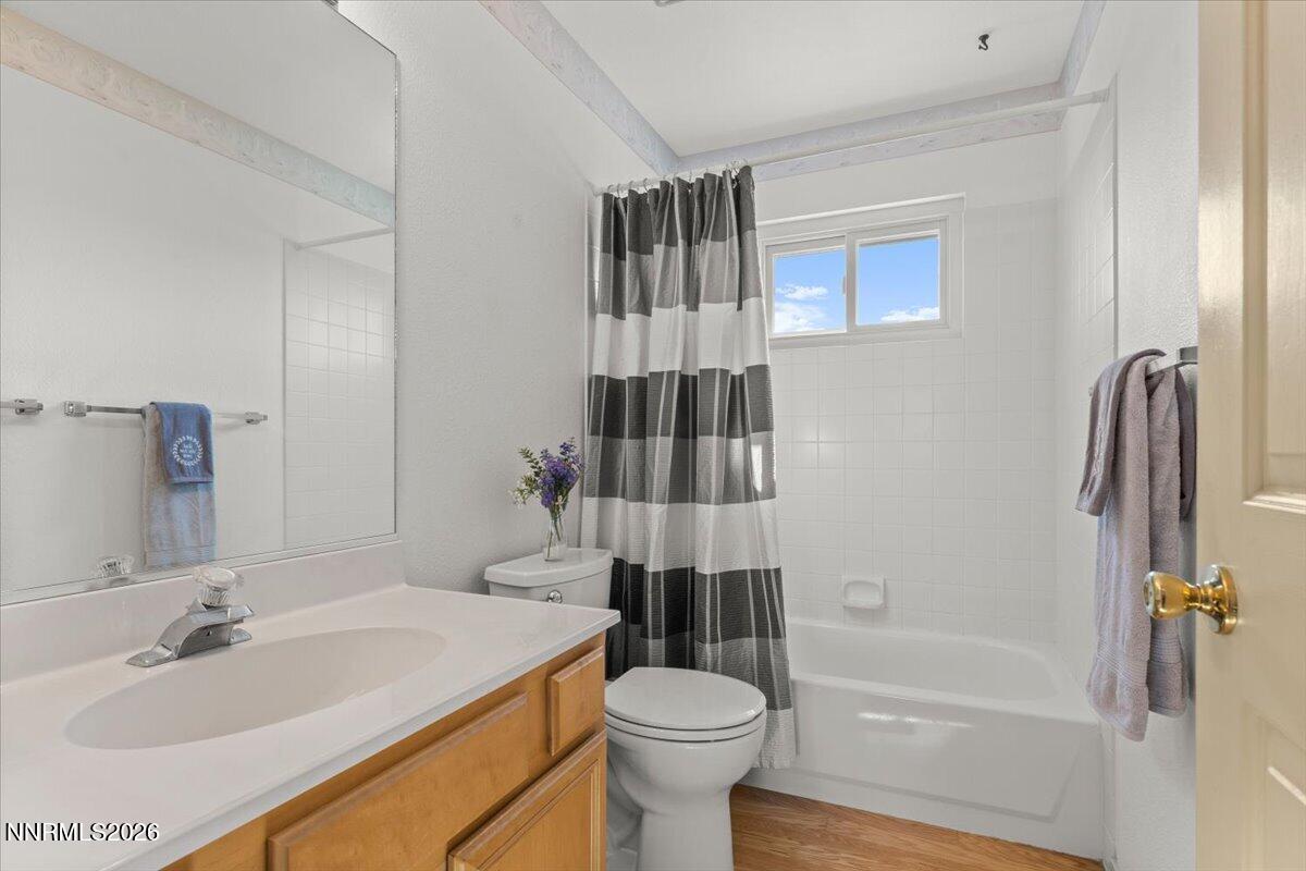 9580 Benedict Drive Sparks, NV 89441 - Photo 24 of 40 a bathroom with a sink toilet and shower